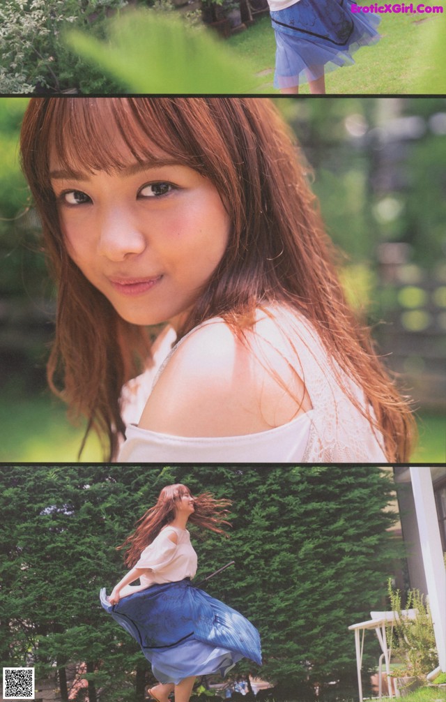 A woman in a white shirt and blue skirt posing for a picture.