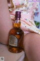 A bottle of whisky sitting on top of a table.