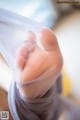 A close up of a person's foot wrapped in a sheet.